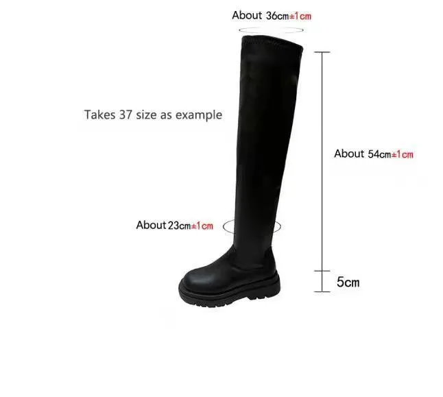 Black women's knee high boots with thick chunky sole and round toe on a winter background