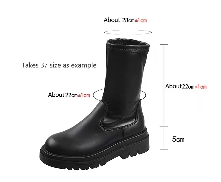 Black women's knee high boots with thick chunky sole and round toe on a winter background