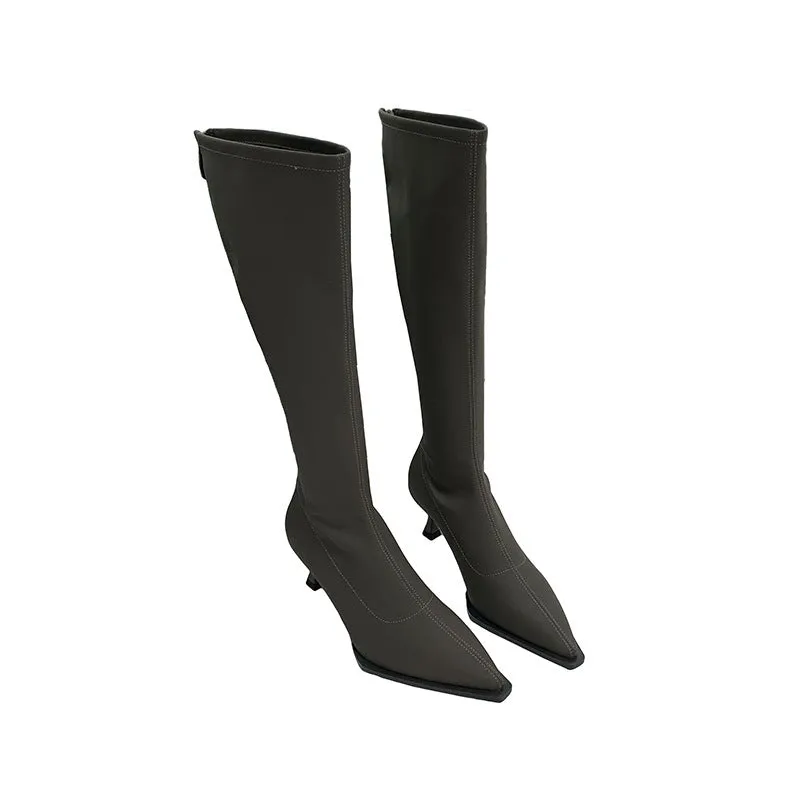 Women's black pointed toe below knee stiletto heel boots with a back zipper on display.