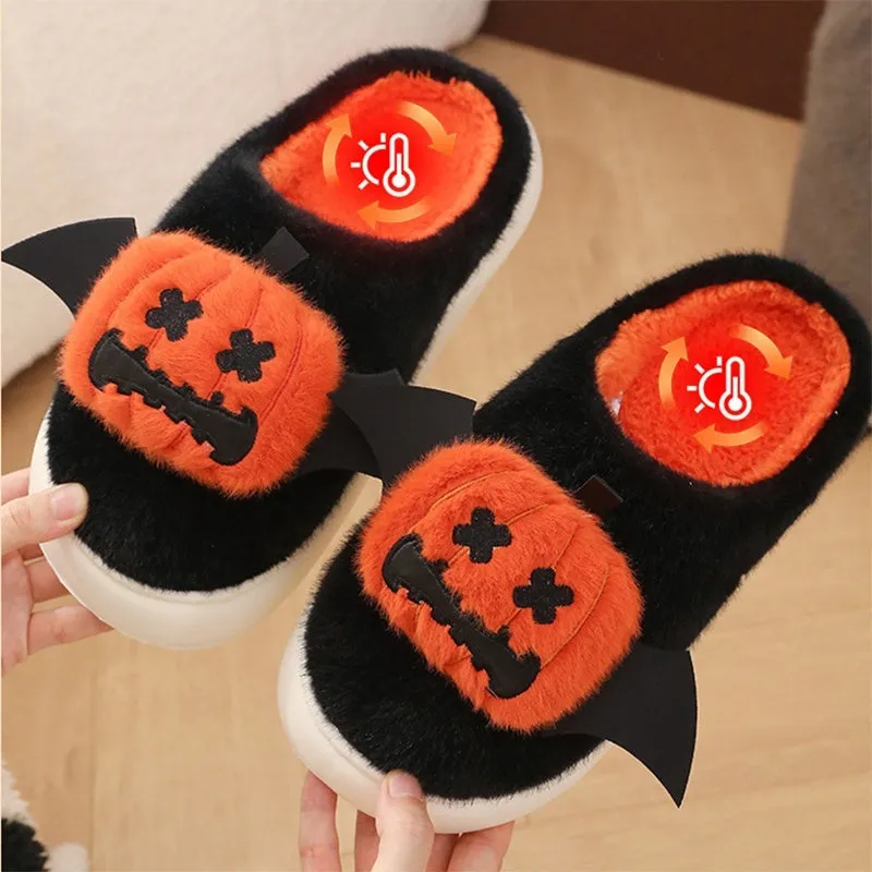 Black Halloween cartoon pumpkin slippers with small wings design on indoor floor