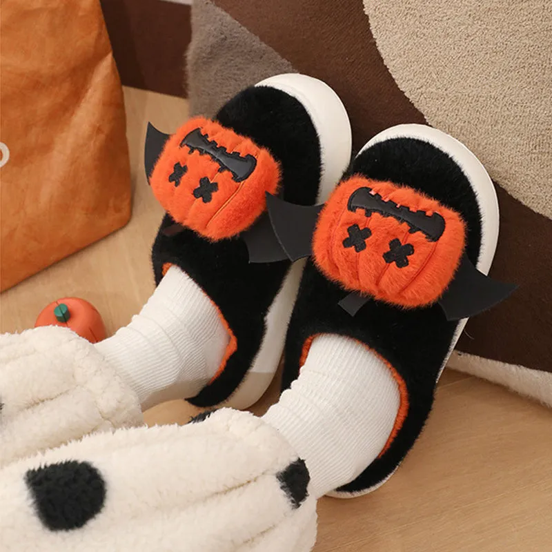 Black Halloween cartoon pumpkin slippers with small wings design on indoor floor