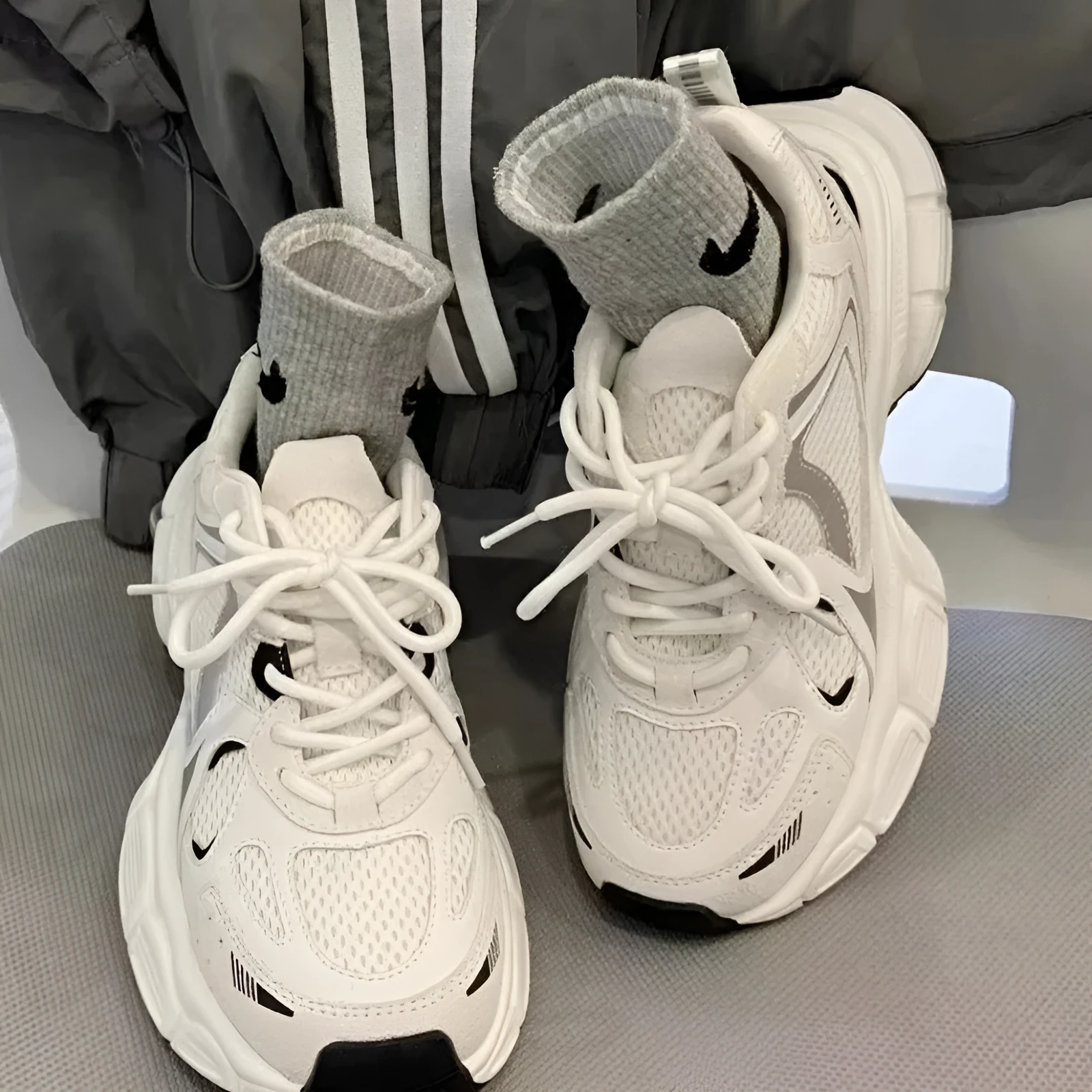Beige mesh platform sports shoes with wedge heel, front lace-up design, and rubber sole