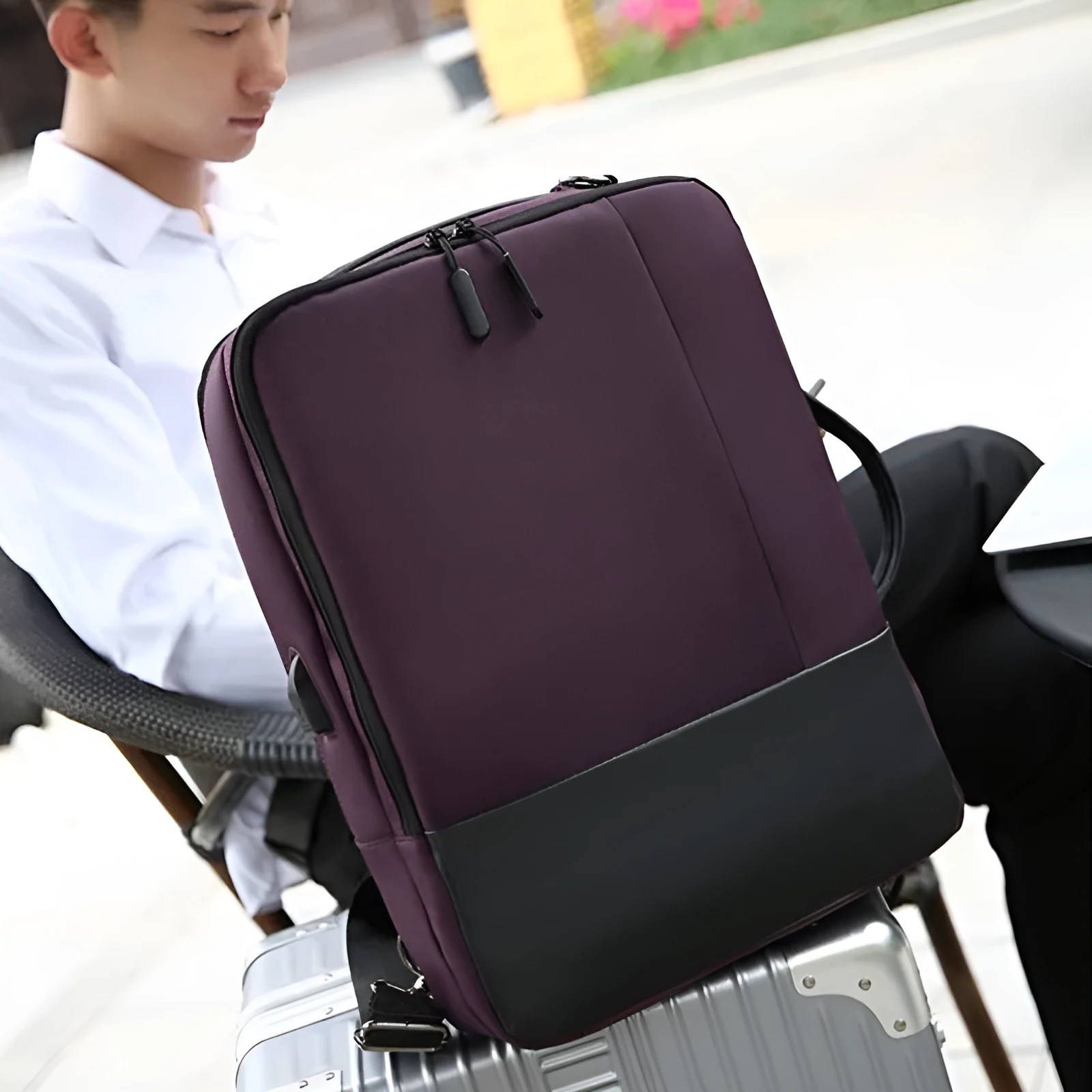 Medium waterproof nylon backpack in brown with zipper closure and soft surface finish for men and women