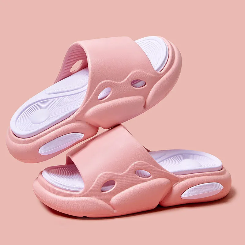Two-colour EVA slippers showing black and white design with thick sole and leather lining