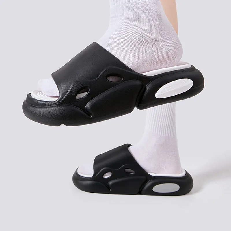 Two-colour EVA slippers showing black and white design with thick sole and leather lining