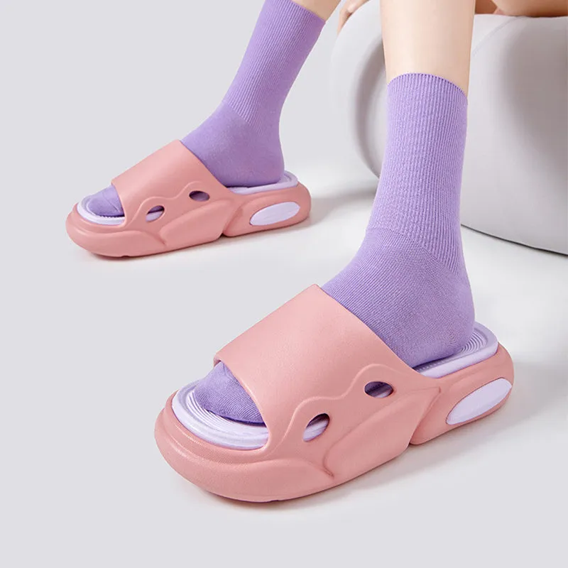 Two-colour EVA slippers showing black and white design with thick sole and leather lining