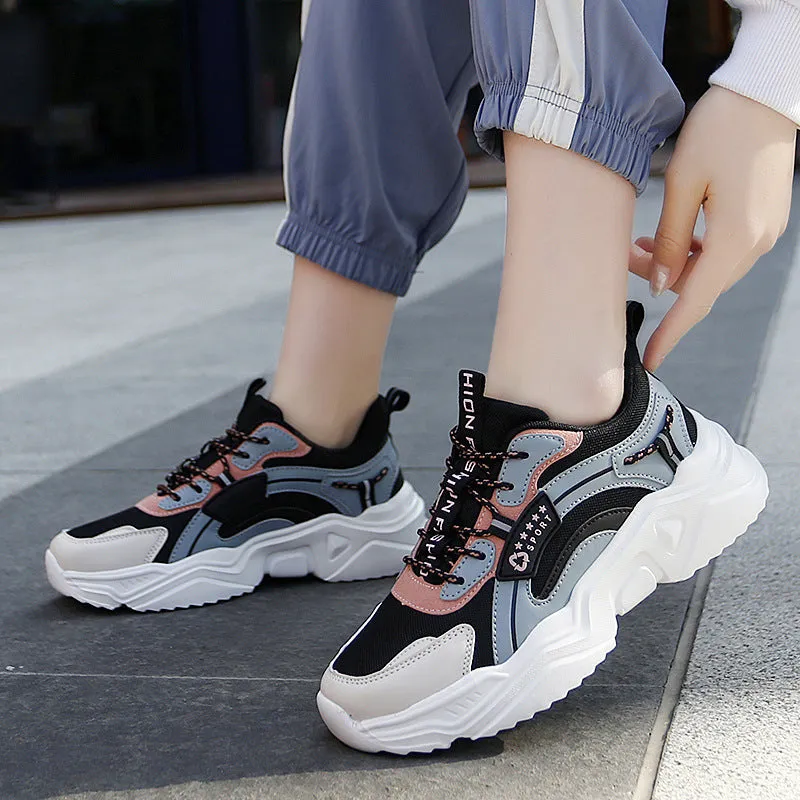 Women's thick-soled casual sports shoes with mesh upper and buckle detailing in black colour