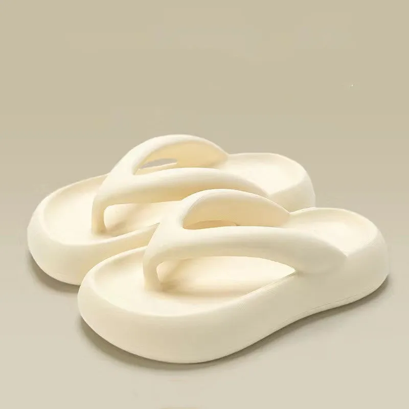 A pair of solid colour thick-soled EVA flip-flops with a bow detail, shown on a light background.