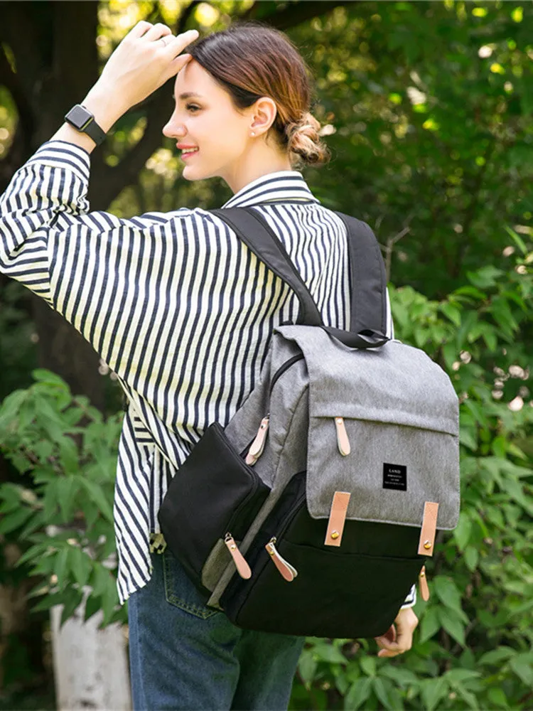 LAND Mommy large grey Oxford cloth diaper backpack with changing mat, shown on a table