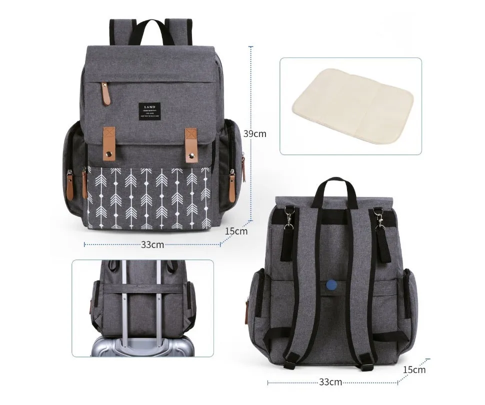 LAND Mommy large grey Oxford cloth diaper backpack with changing mat, shown on a table