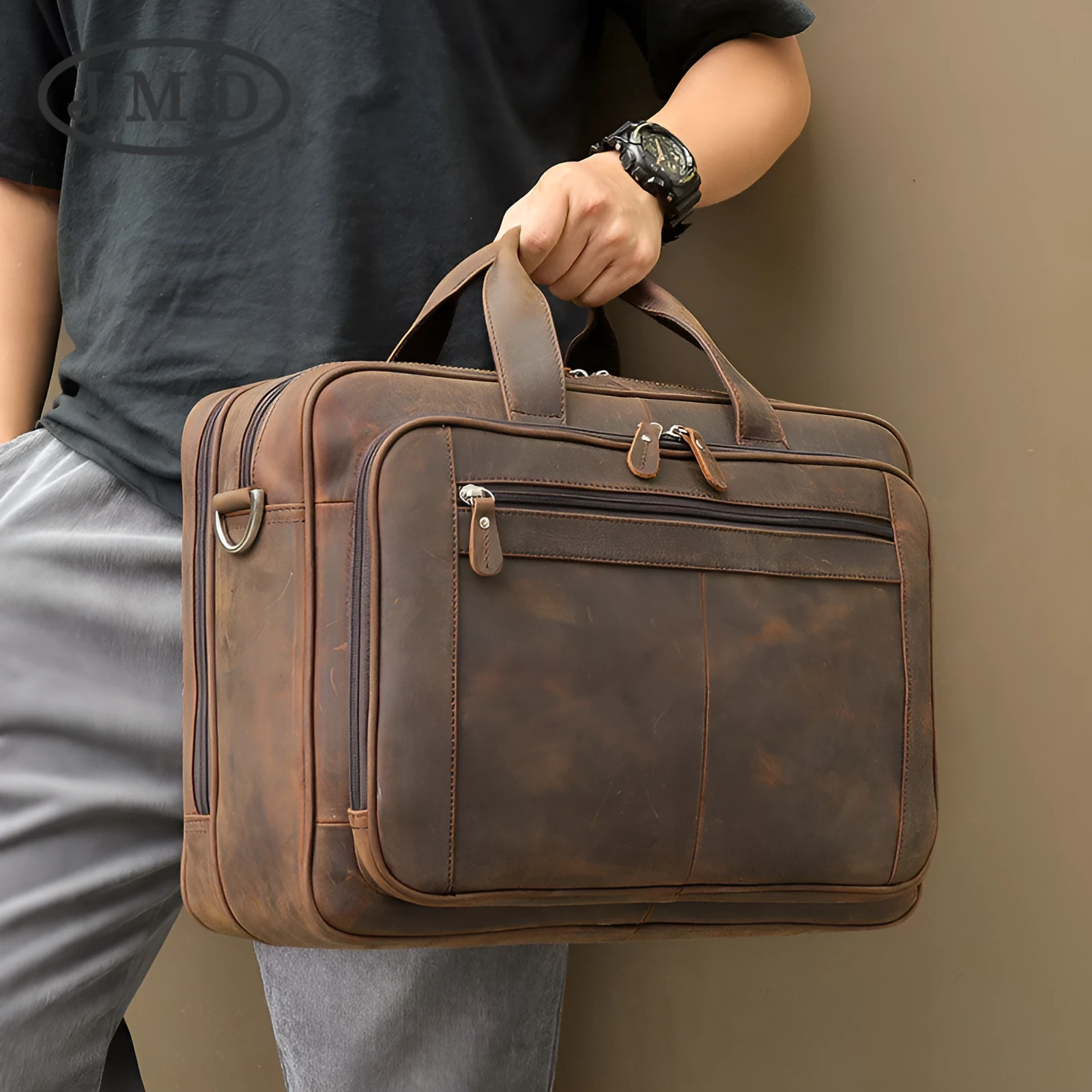 Men's dark brown Crazy Horse leather laptop bag with double handles and zip closure on a neutral background