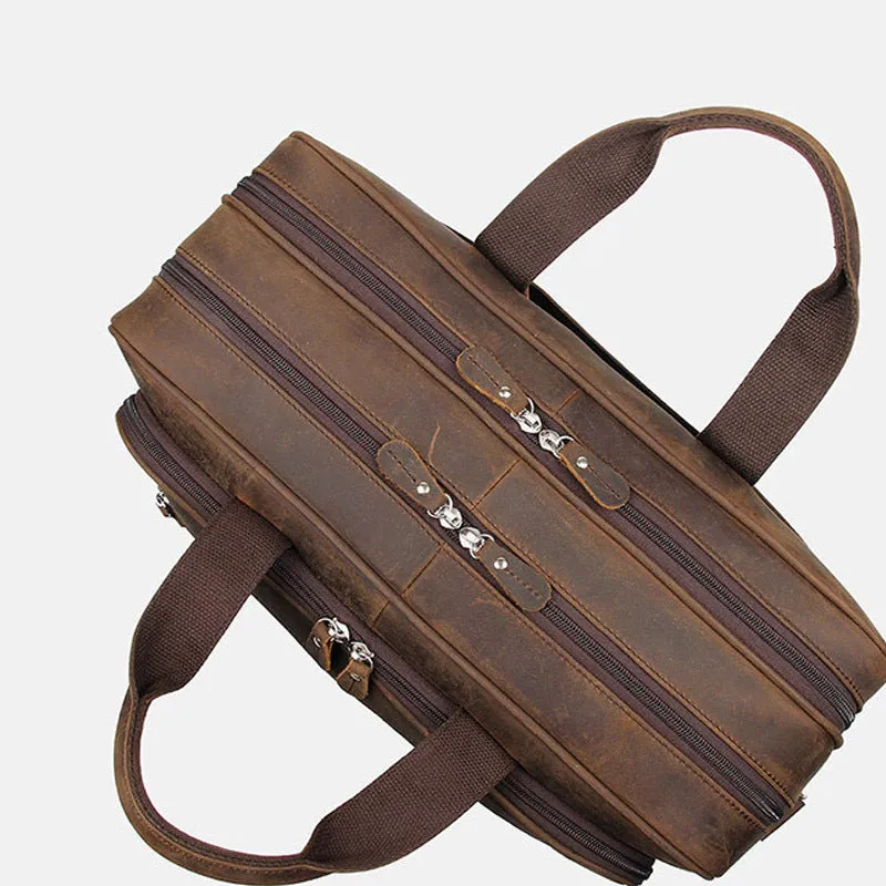 Men's dark brown Crazy Horse leather laptop bag with double handles and zip closure on a neutral background