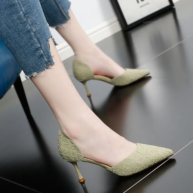 Women's black pointed toe stiletto high heels with a 6-8cm heel on a rubber sole.