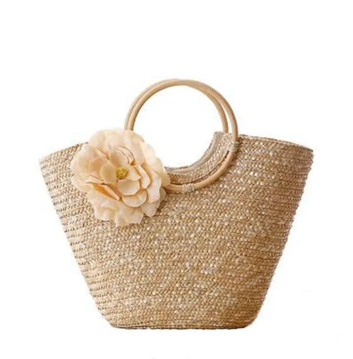 Natural primary colour woven straw bag beach bag handbag with shoulder straps on white background