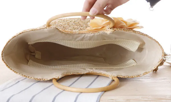 Natural primary colour woven straw bag beach bag handbag with shoulder straps on white background