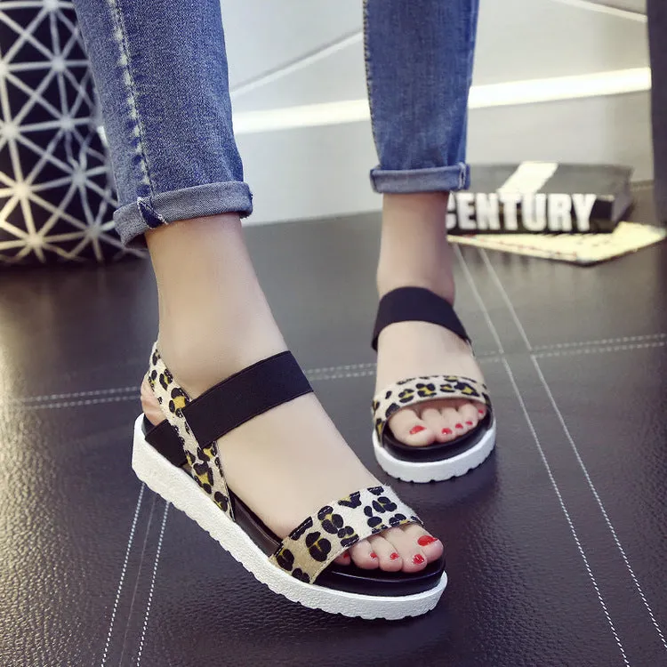 Women's elastic wedge sandals in black with low heel and round toe