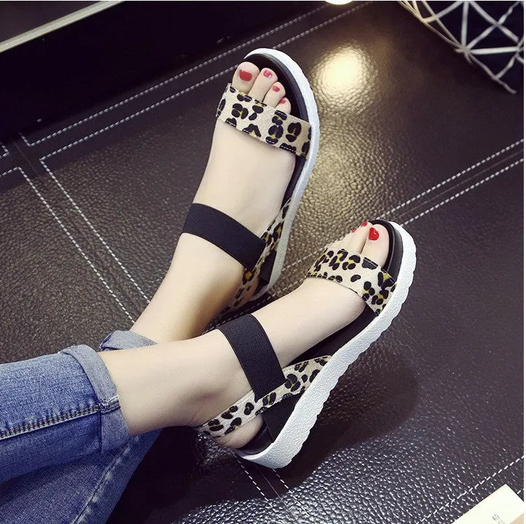 Women's elastic wedge sandals in black with low heel and round toe
