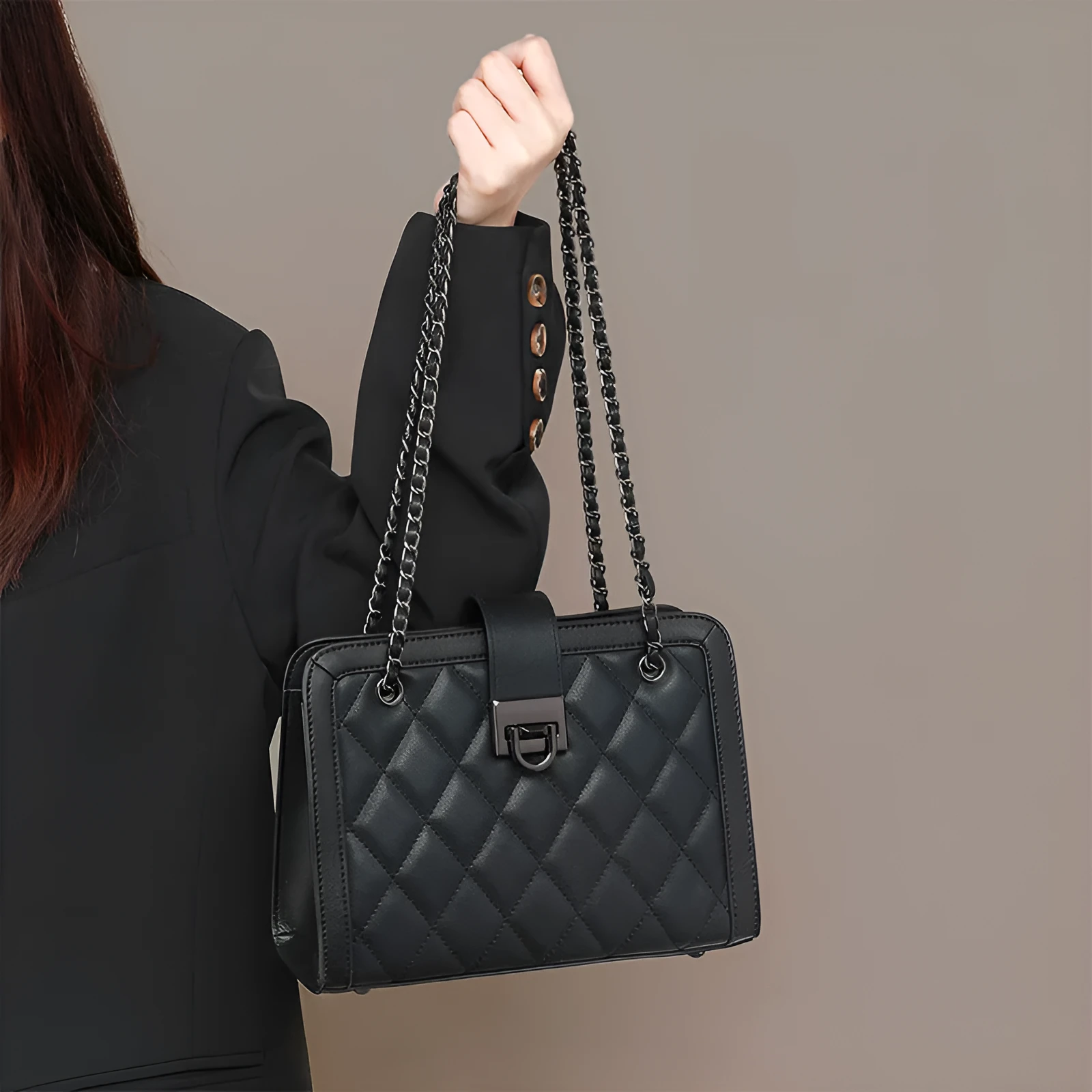 Women's black genuine leather chain crossbody square bag, soft underarm handbag on model