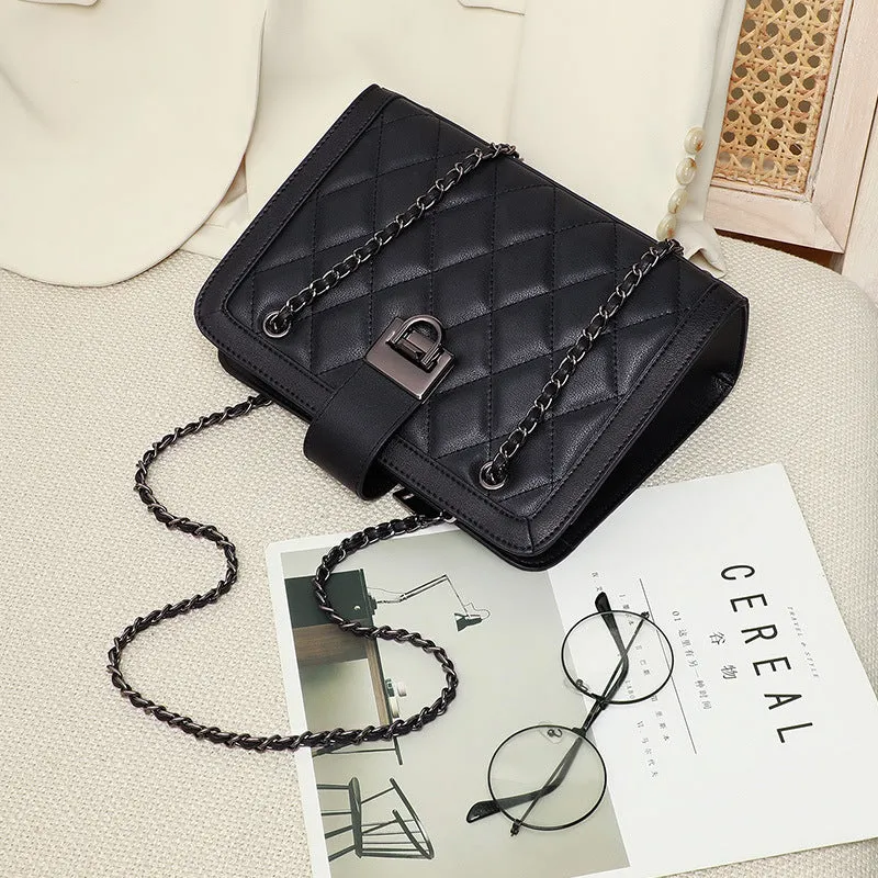 Women's black genuine leather chain crossbody square bag, soft underarm handbag on model