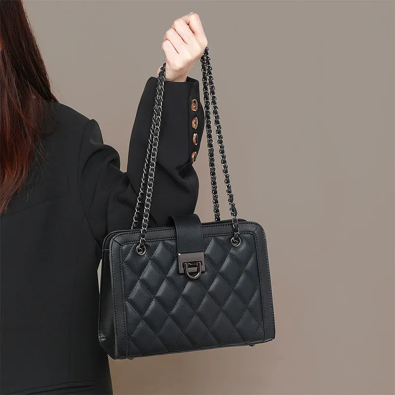 Women's black genuine leather chain crossbody square bag, soft underarm handbag on model