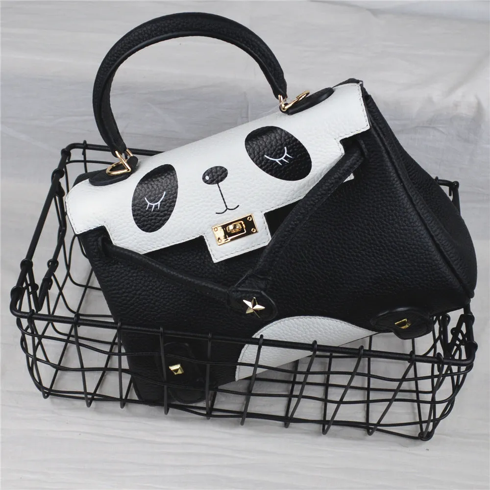 Black and white panda print square leather handbag with horizontal silhouette and structured cowhide body.