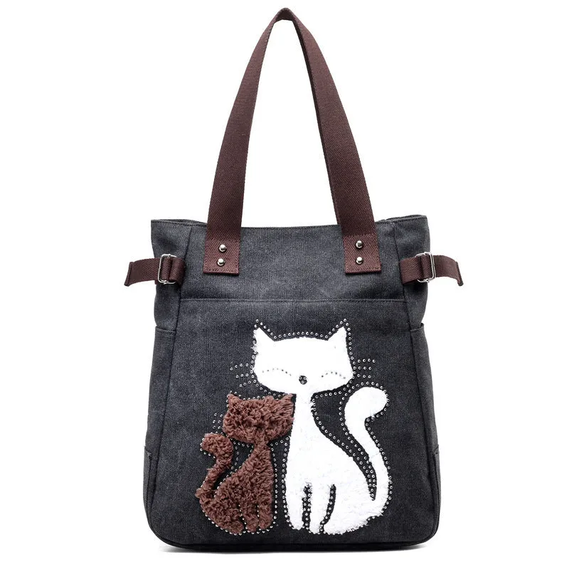 KVKY canvas handbag with plush cat applique in beige colour on a woman's shoulder