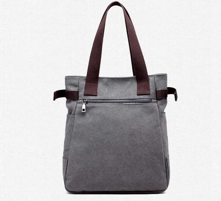 KVKY canvas handbag with plush cat applique in beige colour on a woman's shoulder