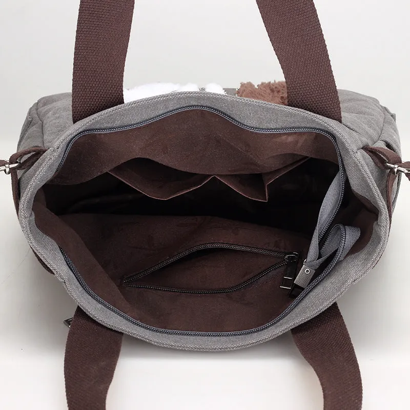 KVKY canvas handbag with plush cat applique in beige colour on a woman's shoulder