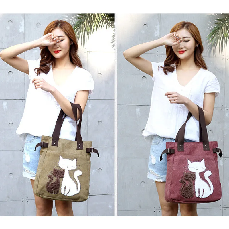 KVKY canvas handbag with plush cat applique in beige colour on a woman's shoulder