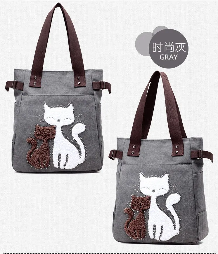 KVKY canvas handbag with plush cat applique in beige colour on a woman's shoulder