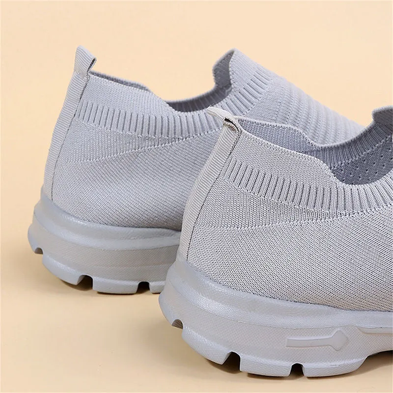 Women's knit sock shoes in beige with breathable upper, round toe, and low rubber sole