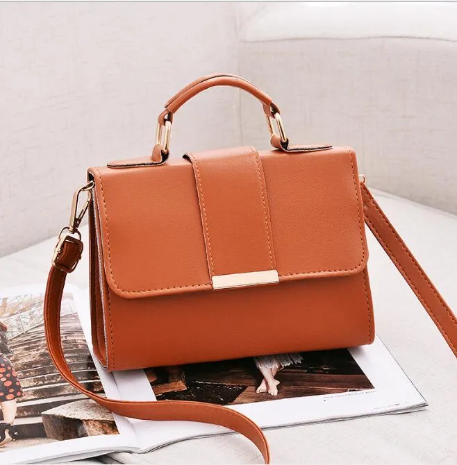 Fashion woman handbag in soft PU with shoulder strap, side view showing polyester lining