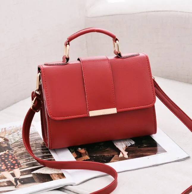 Fashion woman handbag in soft PU with shoulder strap, side view showing polyester lining
