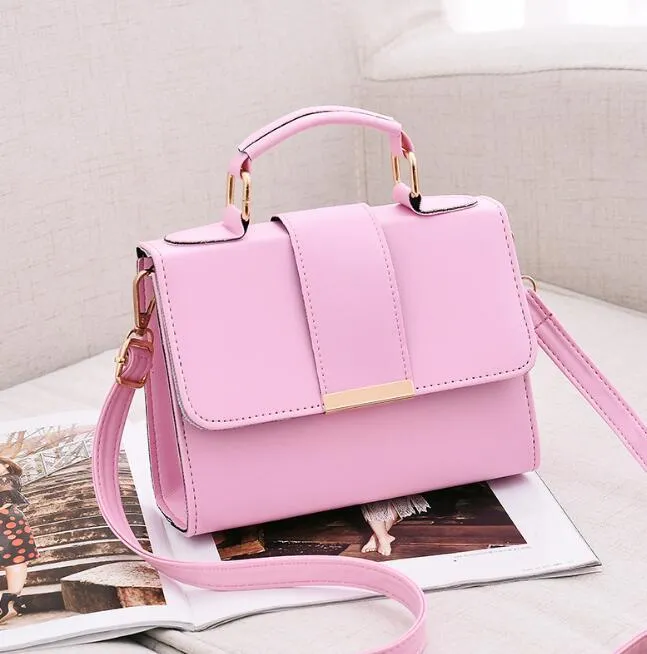Fashion woman handbag in soft PU with shoulder strap, side view showing polyester lining