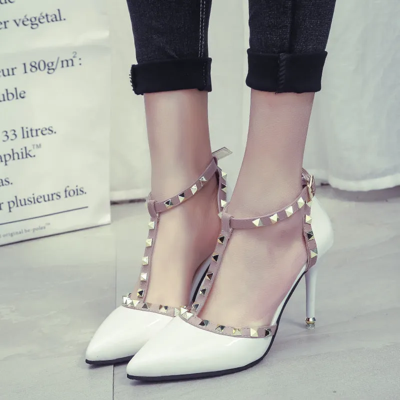 Studded pointed high heels in black with stiletto heel and buckle strap