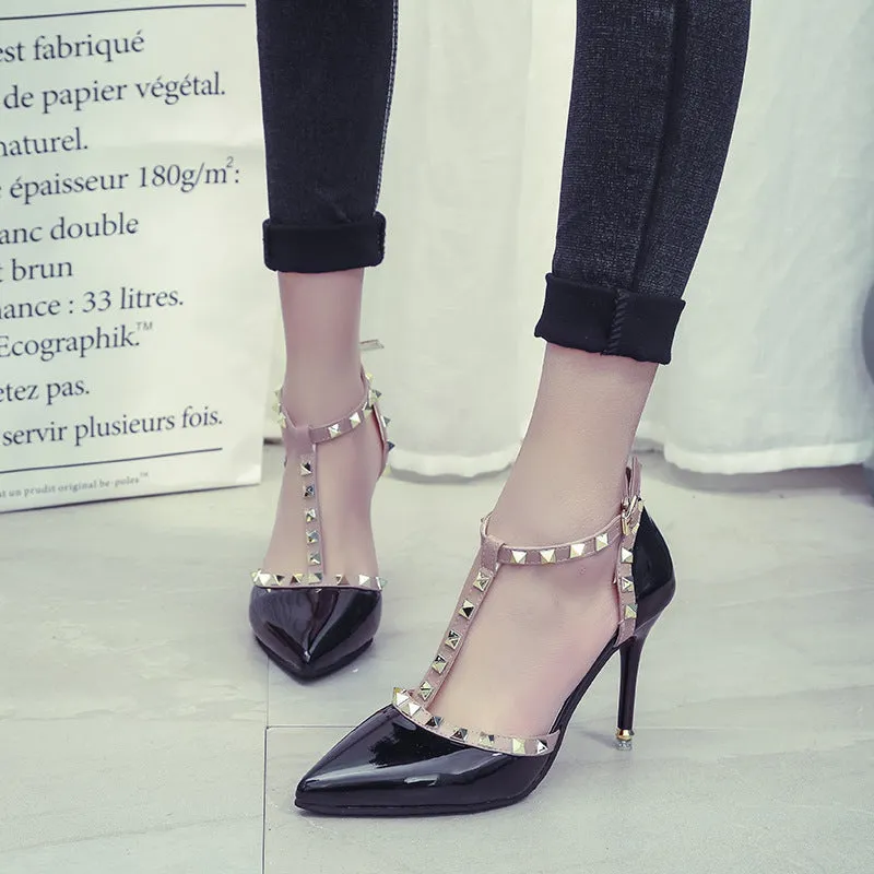 Studded pointed high heels in black with stiletto heel and buckle strap