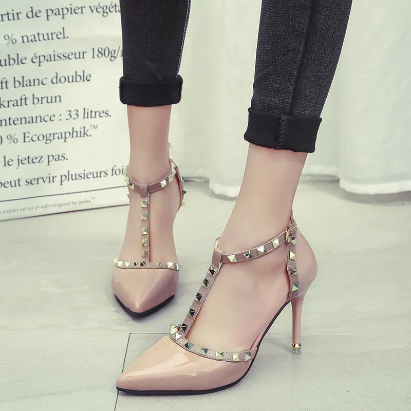 Studded pointed high heels in black with stiletto heel and buckle strap