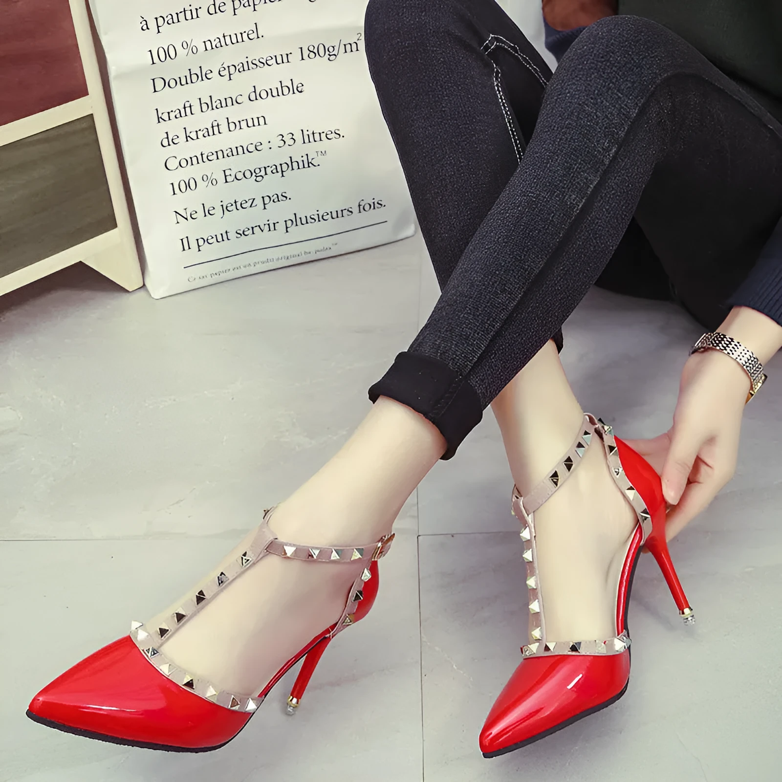 Studded pointed high heels in black with stiletto heel and buckle strap