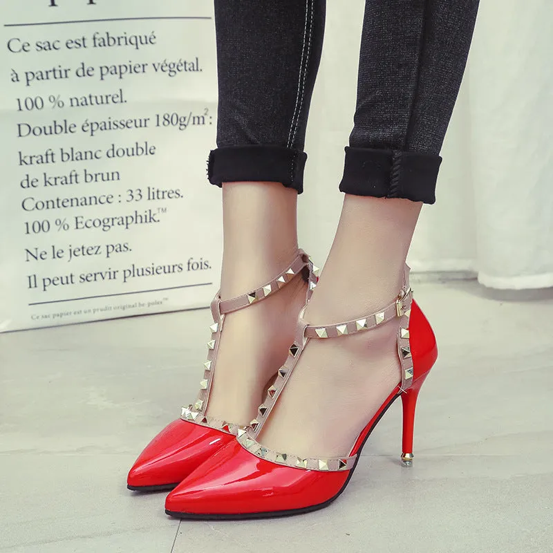 Studded pointed high heels in black with stiletto heel and buckle strap