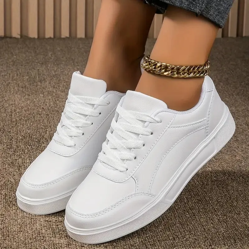 Breathable low-top ladies sneaker with round toe, non-slip rubber sole, and embroidered imitation superfine fibre upper in platinum colour