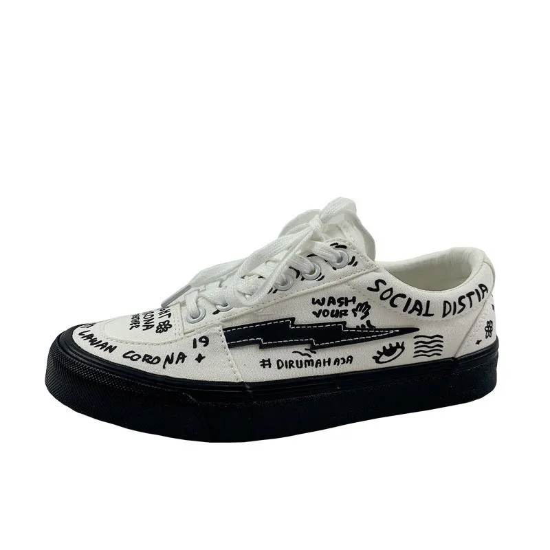 Women's white canvas shoes low top with lace-up tie and graffiti pattern on non-slip vulcanised sole