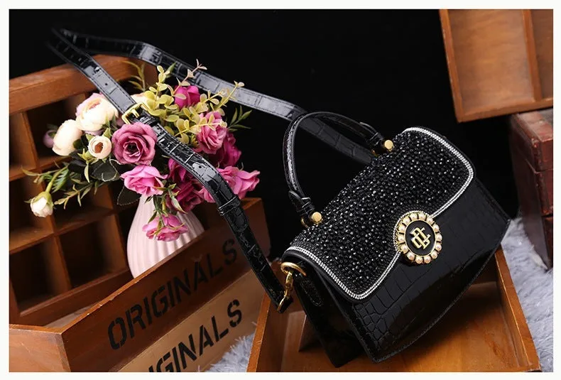 Patent leather diamond portable shoulder bag in black, brown, pink, and red with lock detail and single strap