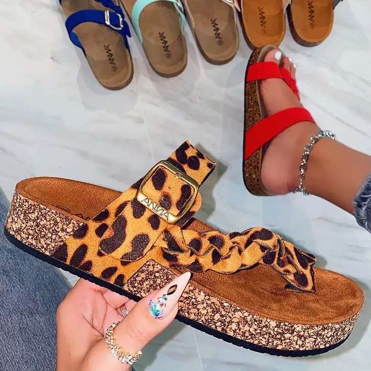 Cork flip flops for women with cow suede upper, rubber sole, decorative stitching, and belt buckle