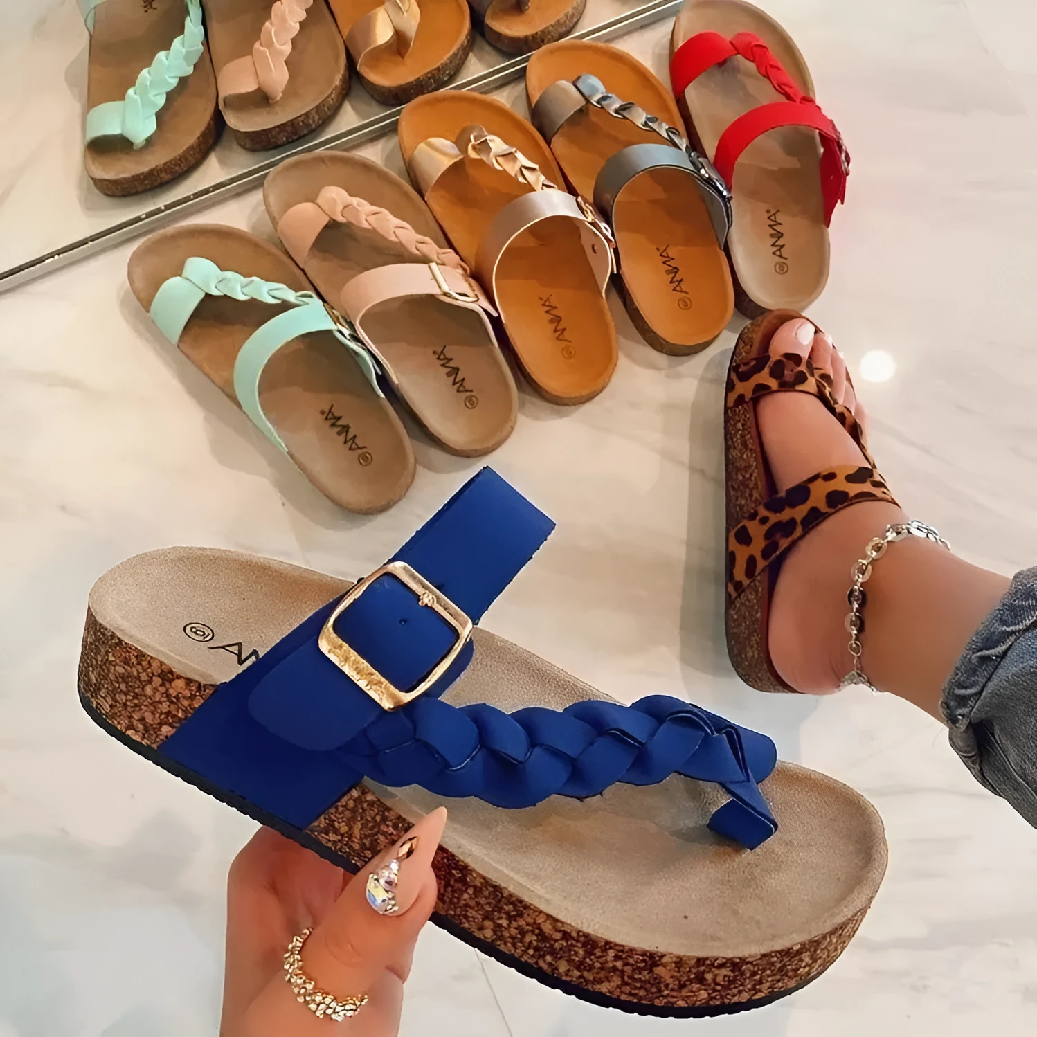Cork flip flops for women with cow suede upper, rubber sole, decorative stitching, and belt buckle