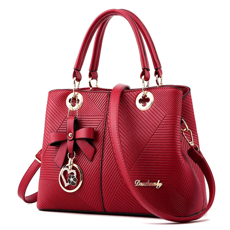 Retro style PU leather handbag with zipper opening and shoulder strap in multiple colours.