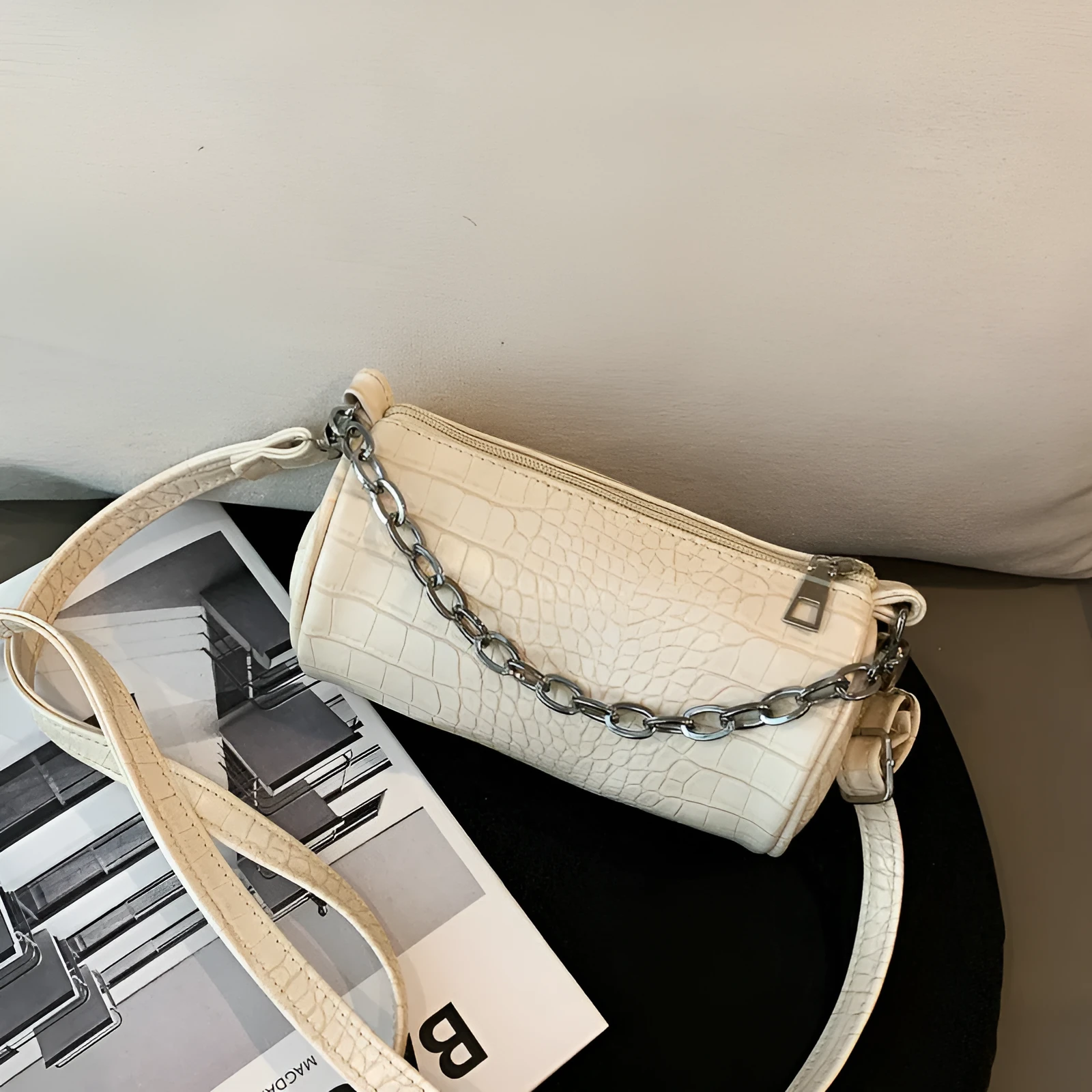 One shoulder cylinder messenger bag in beige PU leather with embossed crocodile pattern and zipper closure