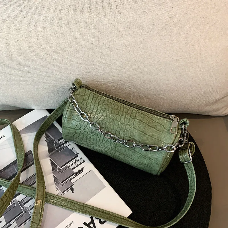 One shoulder cylinder messenger bag in beige PU leather with embossed crocodile pattern and zipper closure