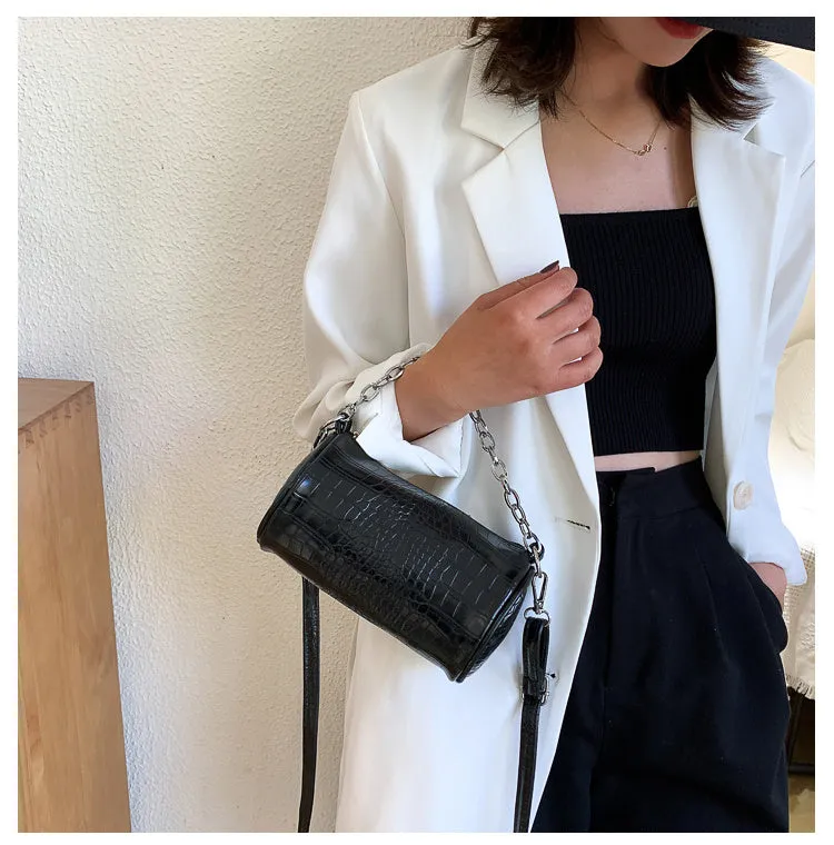 One shoulder cylinder messenger bag in beige PU leather with embossed crocodile pattern and zipper closure