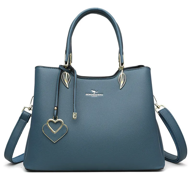 Women's black PU leather messenger bag with shoulder strap and sewing thread detail.