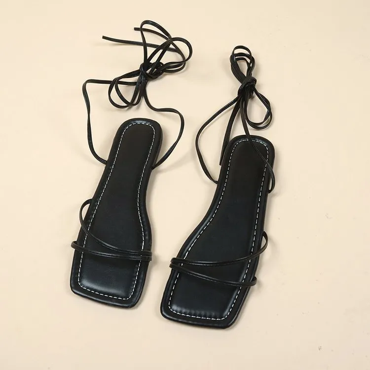 Women's flat sandals with ankle ring bandage cloth design and front lace-up in white colour